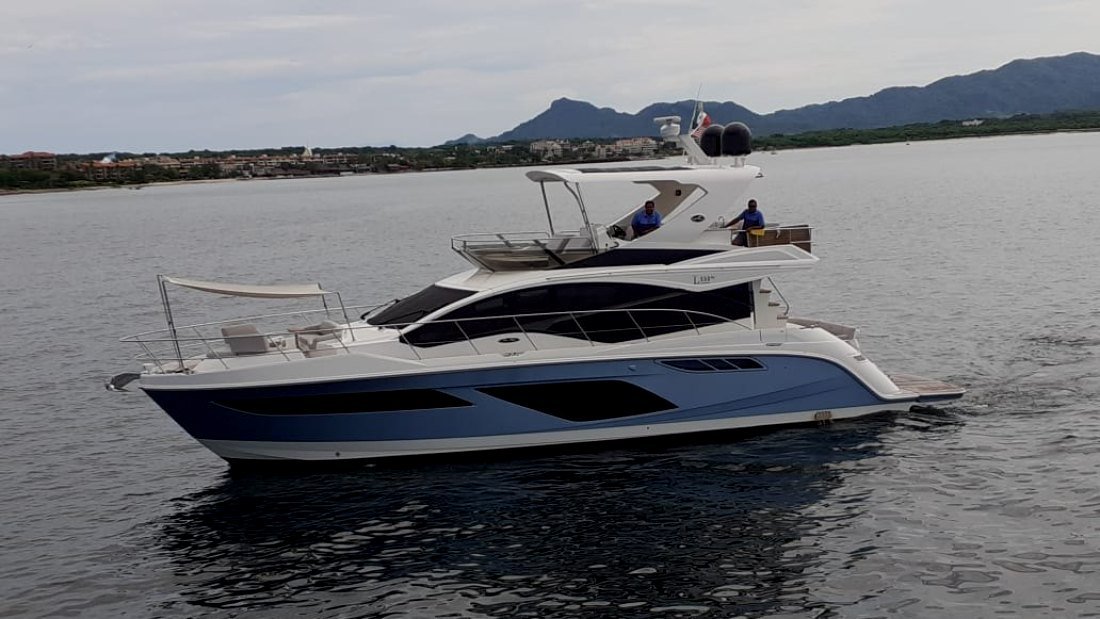 Sea Ray L55 yacht cruising off the Banderas Bay shoreline on a Puerto Vallarta photo charter