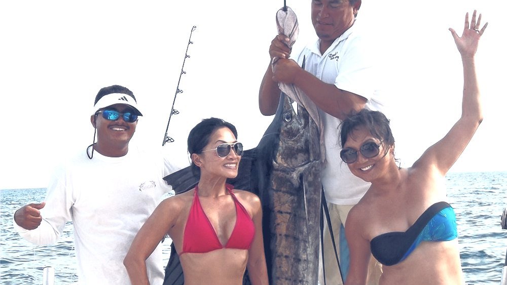 Sportfishing yacht running across Banderas Bay on a Puerto Vallarta fishing charter